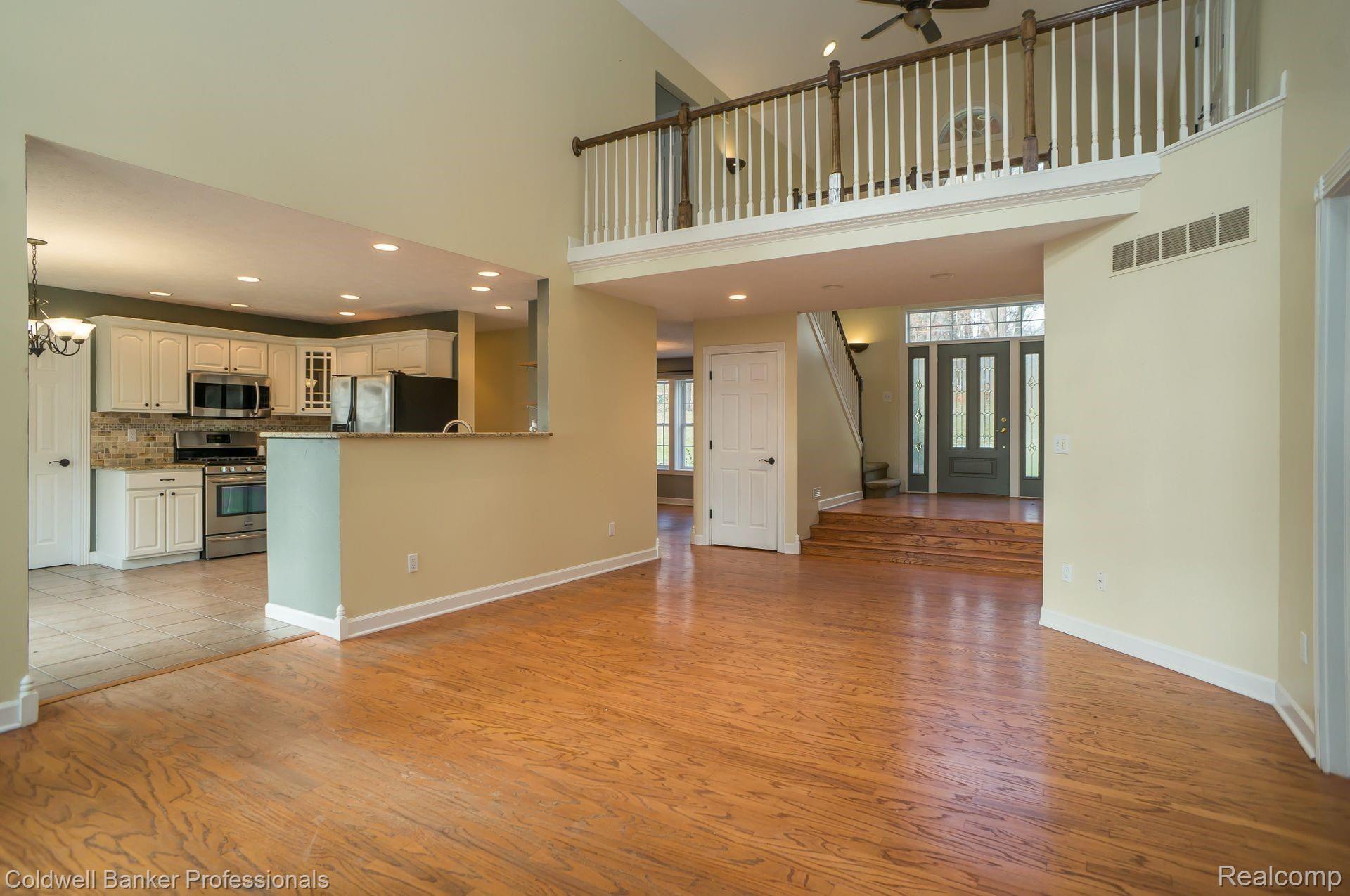 2480 Melvin Road Pinckney, MI 48169 - Photo 5 of 39 Great Room view from fireplace looking into kitchen