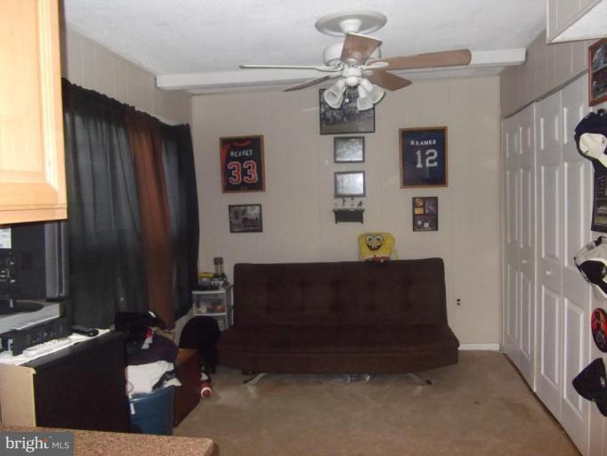 8013 Mandan Road, Unit 304 Greenbelt, MD 20770 - Photo 11 of 12 a living room with furniture
