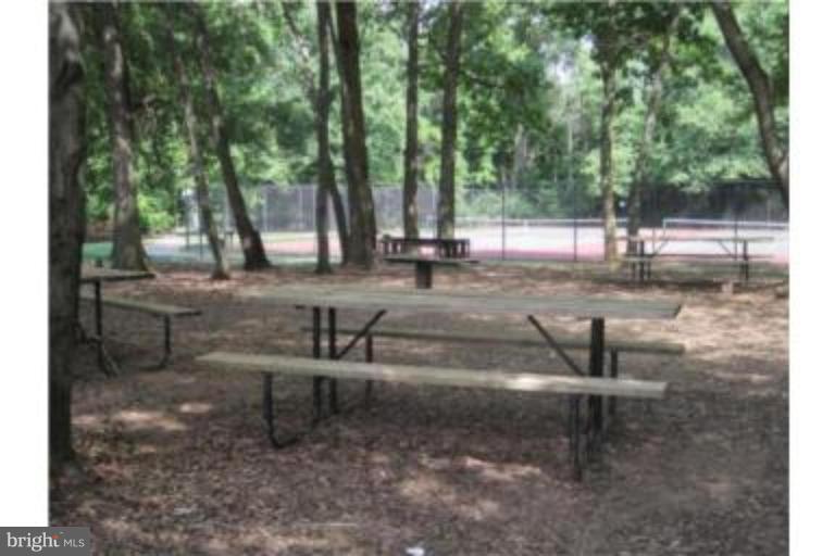 8013 Mandan Road, Unit 304 Greenbelt, MD 20770 - Photo 3 of 12 a view of a park with sitting area