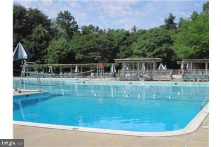 8013 Mandan Road, Unit 304 Greenbelt, MD 20770 - Photo 4 of 12 a view of house with a swimming pool