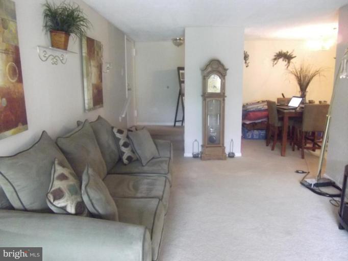 8013 Mandan Road, Unit 304 Greenbelt, MD 20770 - Photo 9 of 12 a living room with furniture