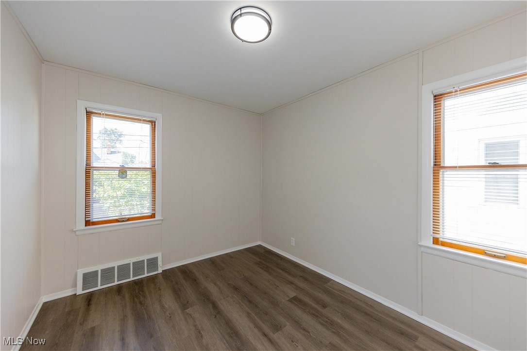 29103 Barjode Road Eastlake, OH 44095 - Photo 9 of 31 Unfurnished room featuring dark wood-style floors and baseboards
