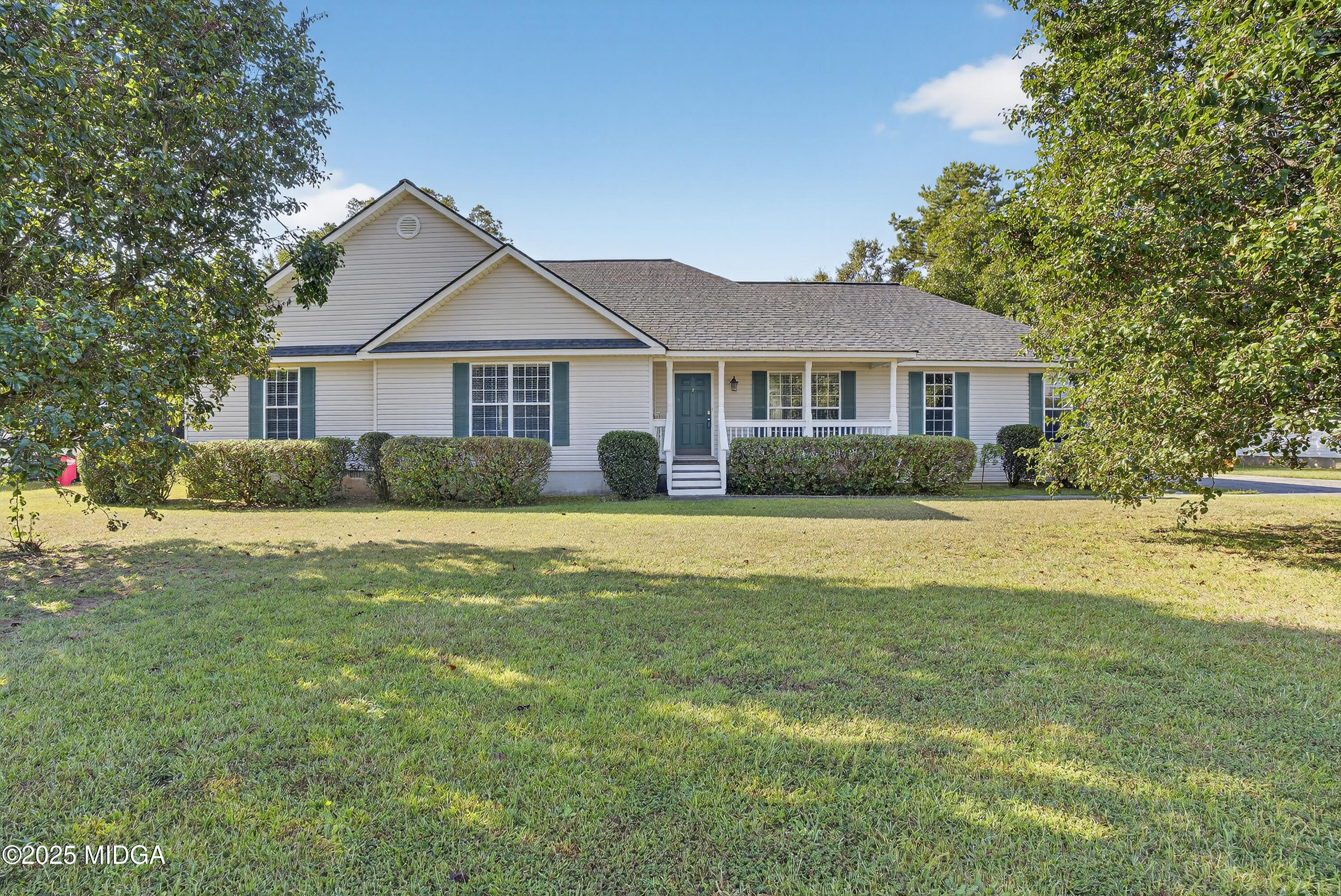 a front view of house with yard and green space