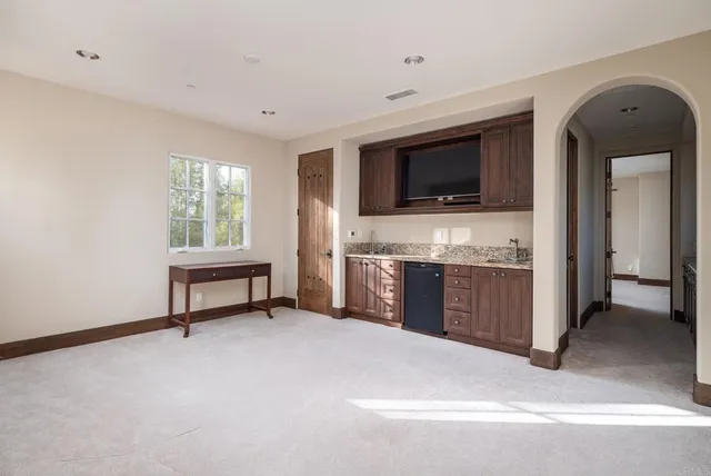 a view of living room with furniture and flat screen tv
