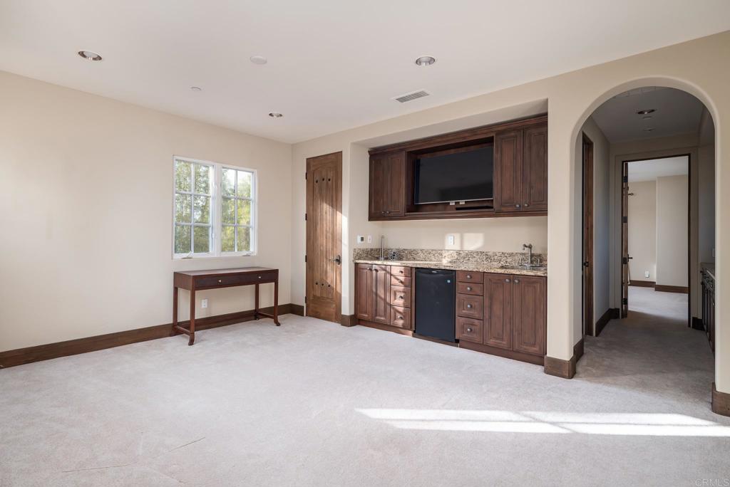 18596 Corte Fresco Rancho Santa Fe, CA 92091 - Photo 32 of 41 a view of living room with furniture and flat screen tv