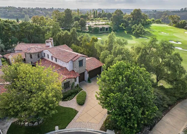 a view of a lake with a house in the background