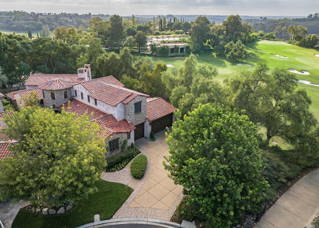 18596 Corte Fresco Rancho Santa Fe, CA 92091 - Photo 36 of 41 a view of a lake with a house in the background