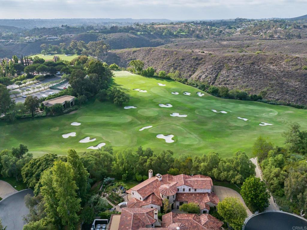 18596 Corte Fresco Rancho Santa Fe, CA 92091 - Photo 37 of 41 an aerial view of a house with a yard