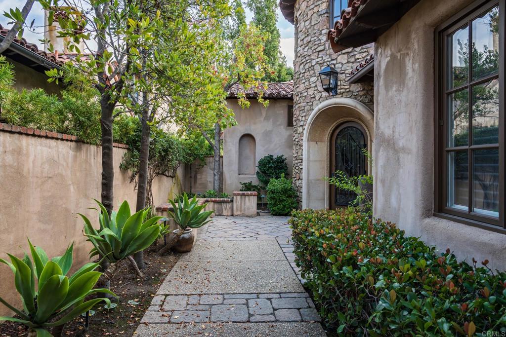 18596 Corte Fresco Rancho Santa Fe, CA 92091 - Photo 6 of 41 a front view of a house with garden