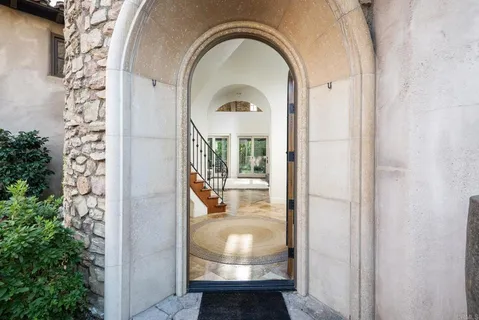 a view of a entryway door to other room