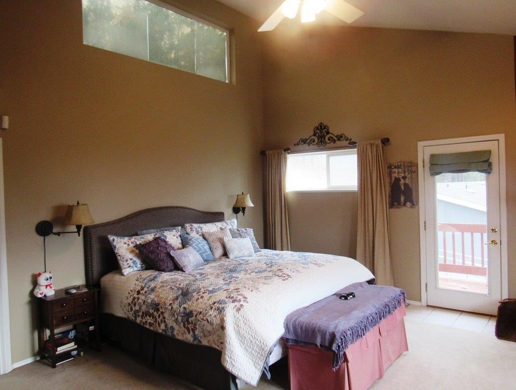 1961 Crow Road Merlin, OR 97532 - Photo 18 of 35 a bedroom with a bed and a window