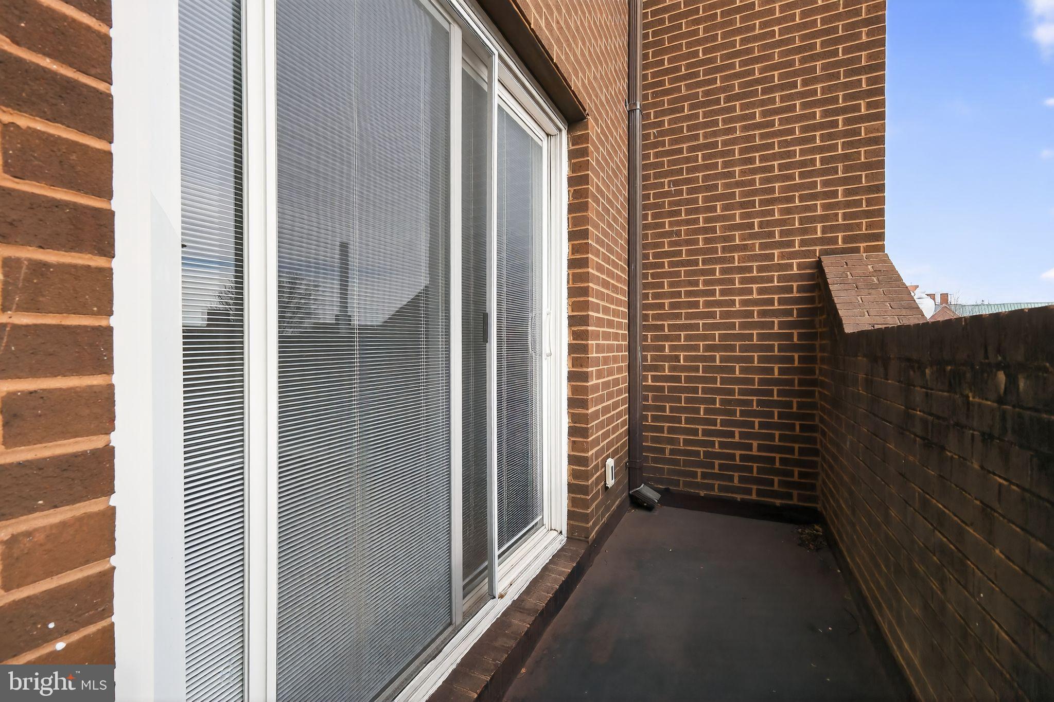 1204 1/2 33rd Street Northwest Washington, DC 20007 - Photo 12 of 20 Charming balcony with urban views.