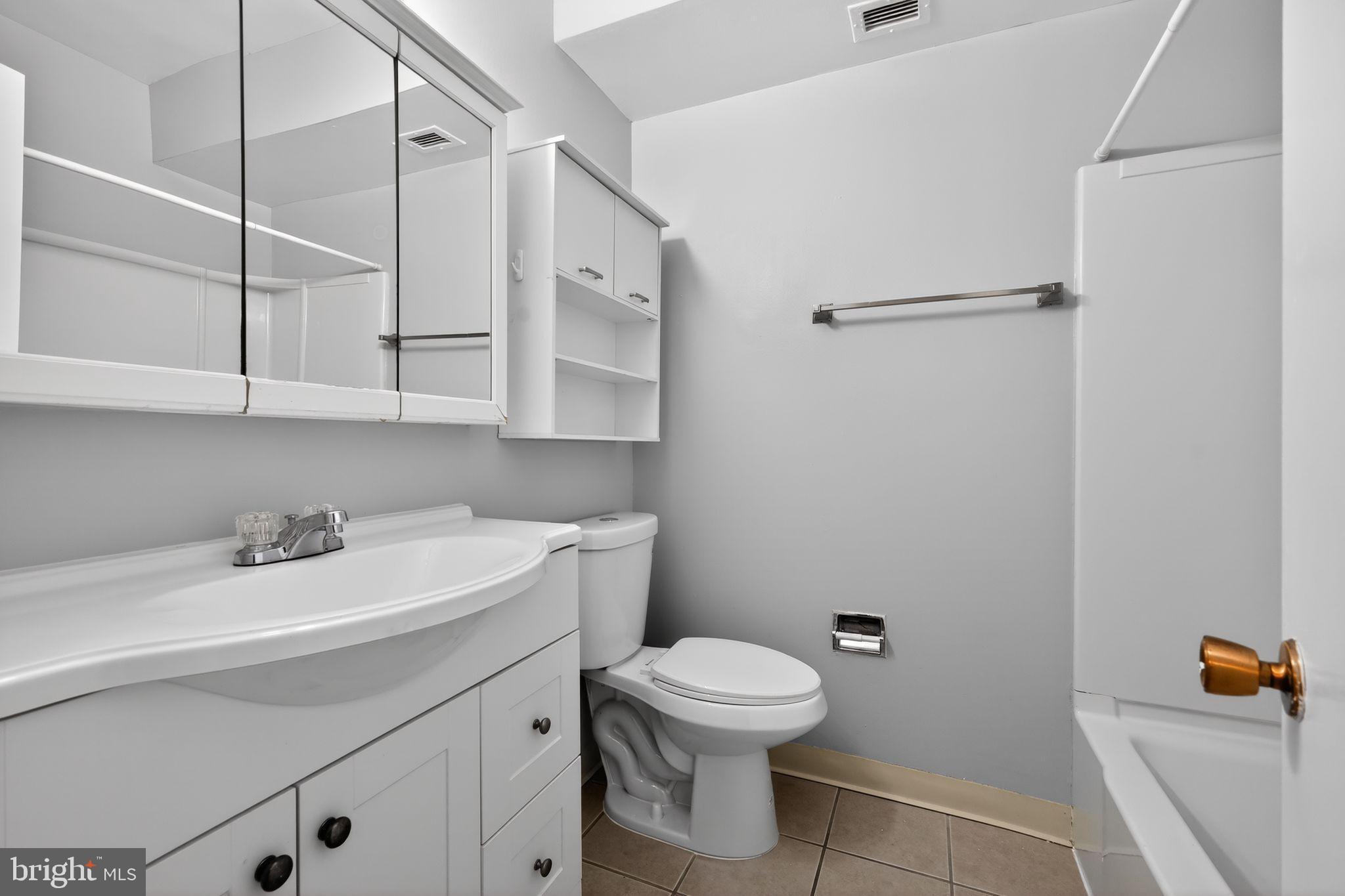 1204 1/2 33rd Street Northwest Washington, DC 20007 - Photo 15 of 20 Modern bathroom with sleek finishes.