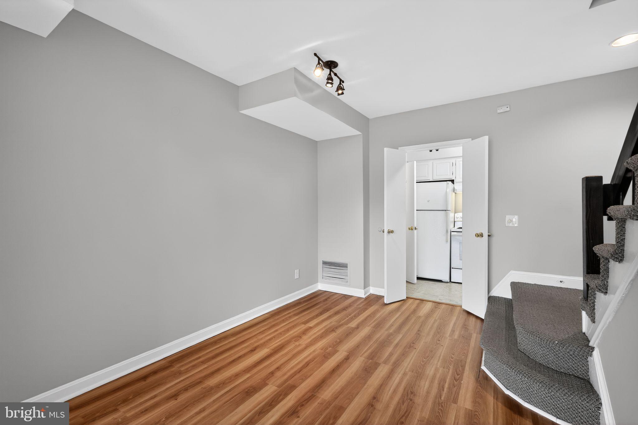 1204 1/2 33rd Street Northwest Washington, DC 20007 - Photo 6 of 20 Bright, modern space with inviting wood floors.