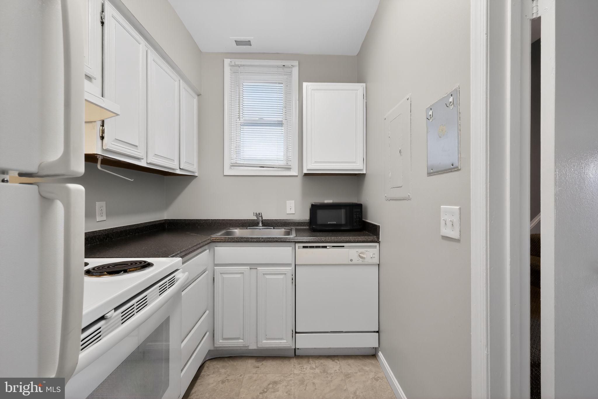 1204 1/2 33rd Street Northwest Washington, DC 20007 - Photo 9 of 20 Cozy kitchen with modern appliances.