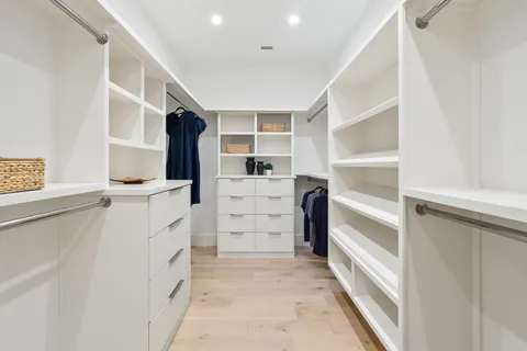 a view of walk in closet with stairs
