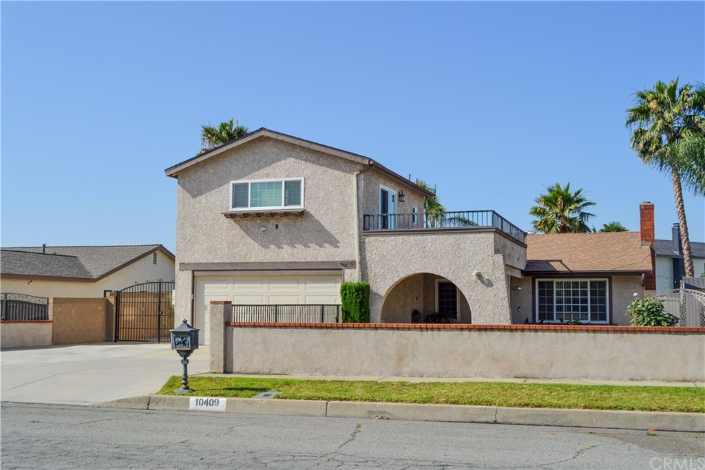 10409 Victoria Street Rancho Cucamonga, CA 91701 - Photo 1 of 1 a front view of a house with garden
