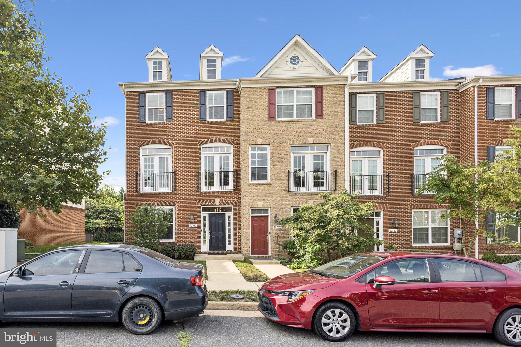 a front view of a house with parking space