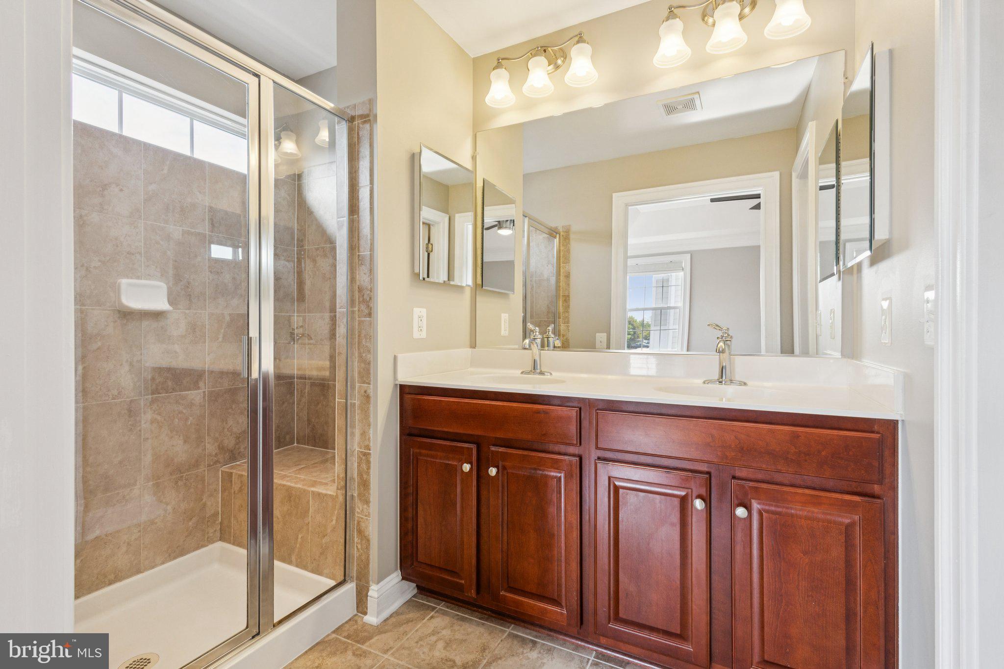 42761 Hay Road Ashburn, VA 20147 - Photo 14 of 46 a bathroom with a sink and a mirror