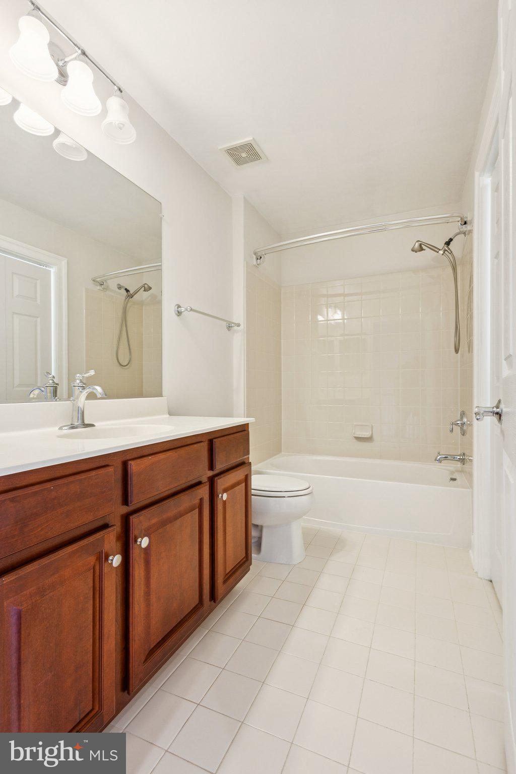 42761 Hay Road Ashburn, VA 20147 - Photo 17 of 46 a spacious bathroom with a tub sink shower and mirror