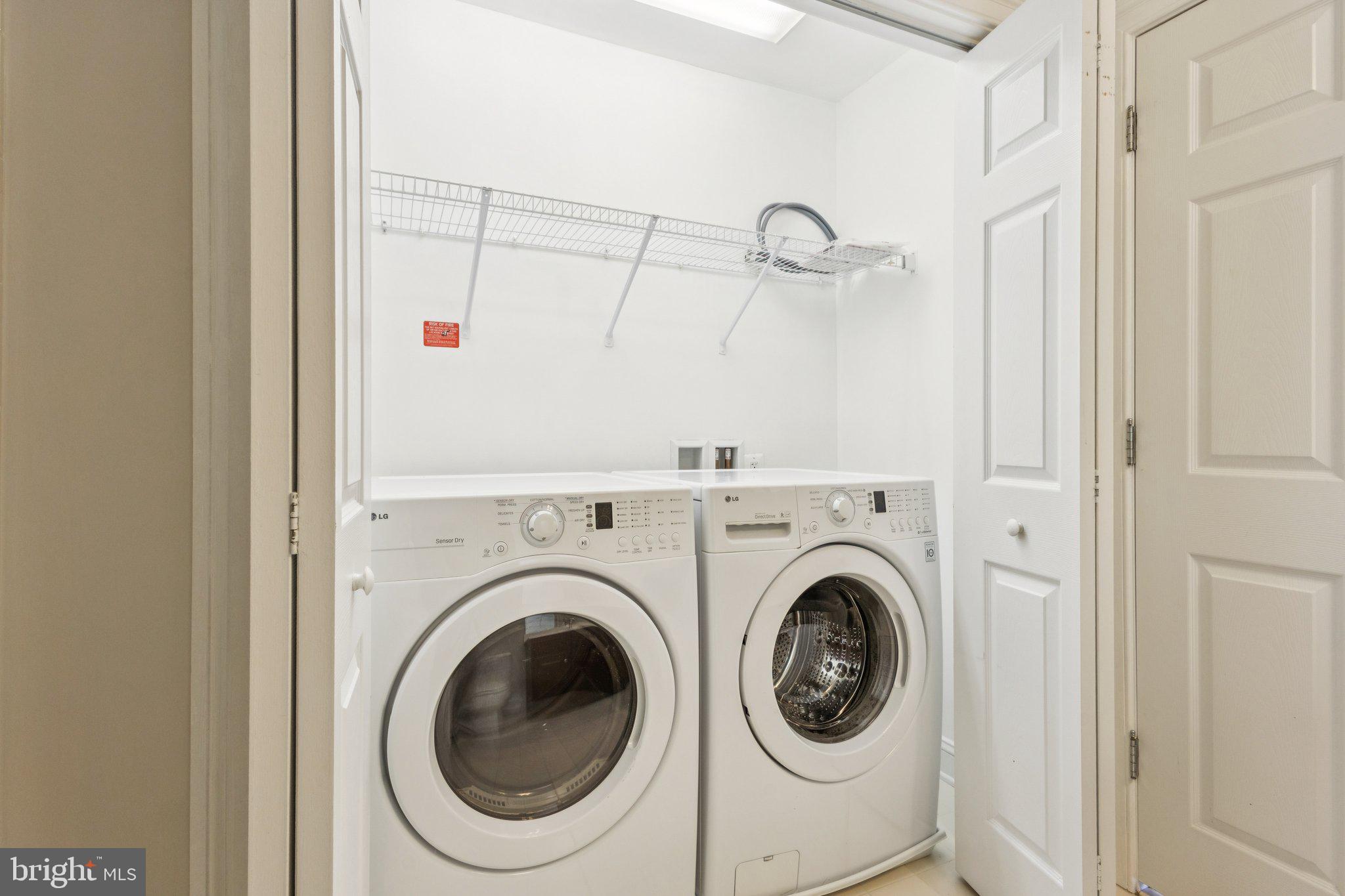 42761 Hay Road Ashburn, VA 20147 - Photo 18 of 46 a utility room with dryer and washer