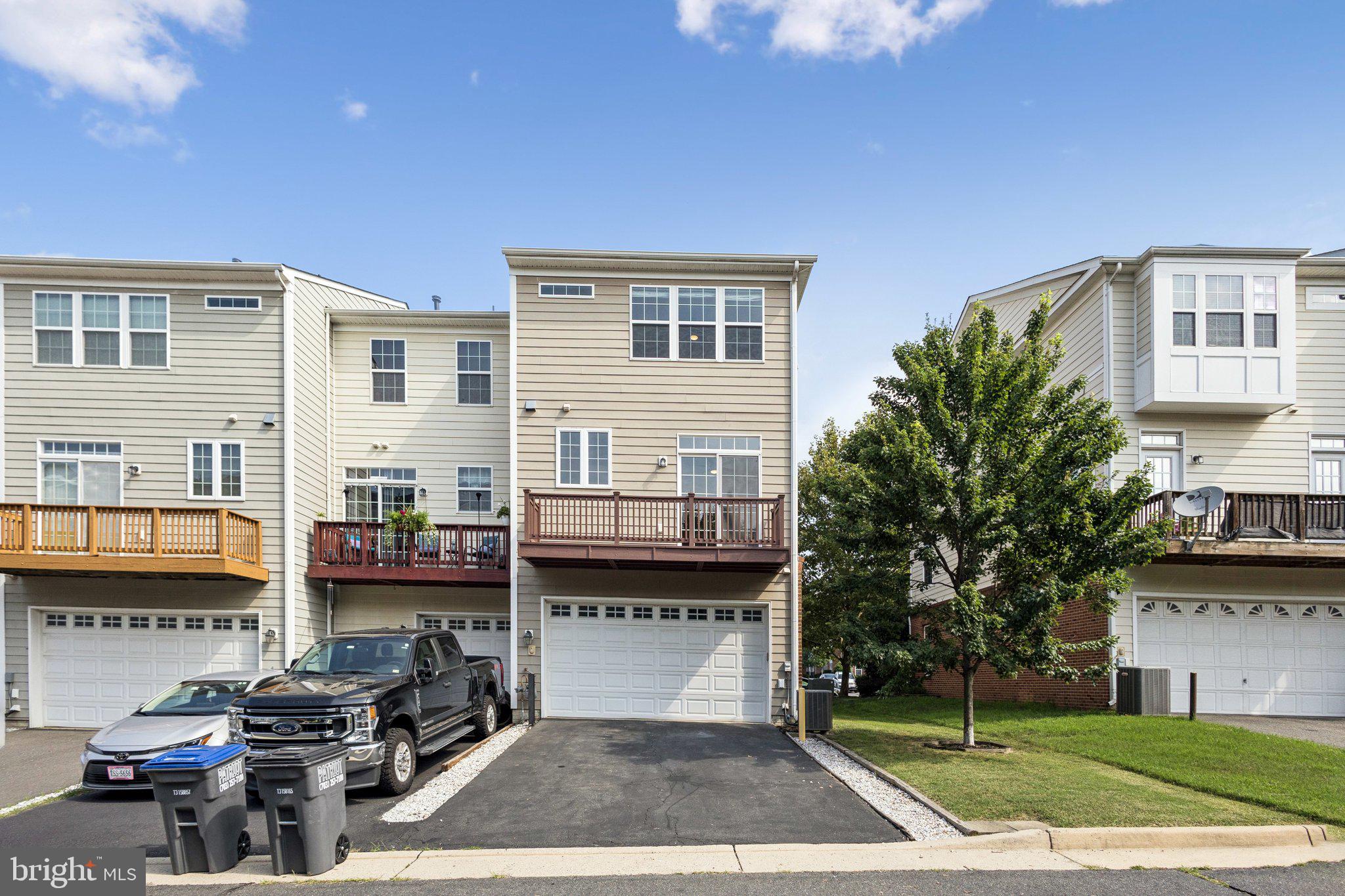 42761 Hay Road Ashburn, VA 20147 - Photo 20 of 46 a front view of a house with a garden