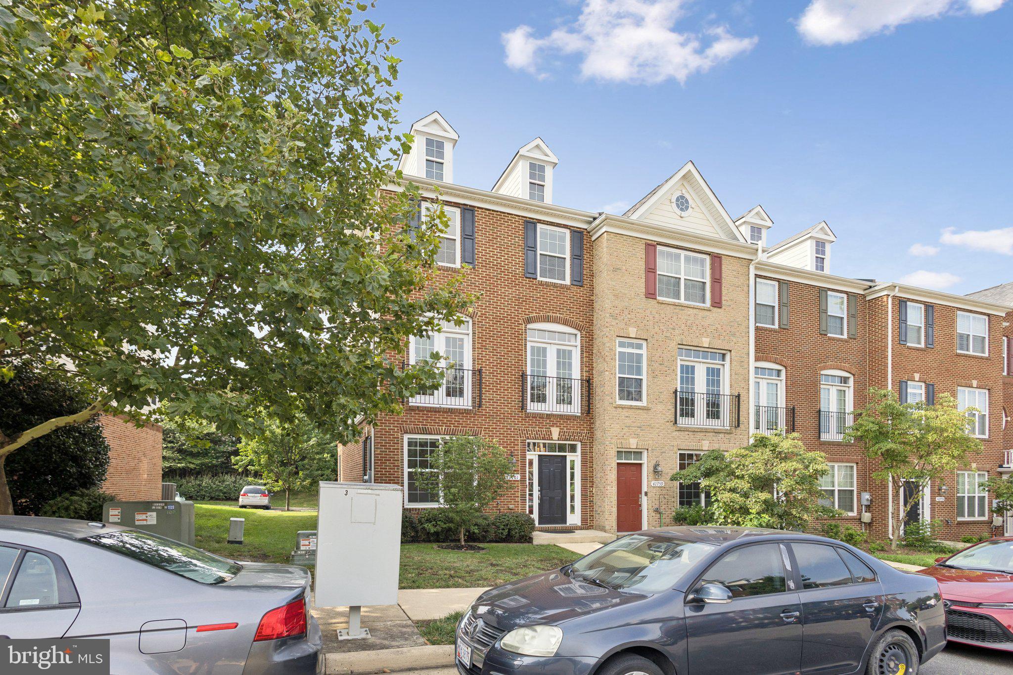 42761 Hay Road Ashburn, VA 20147 - Photo 23 of 46 a front view of a house with a yard