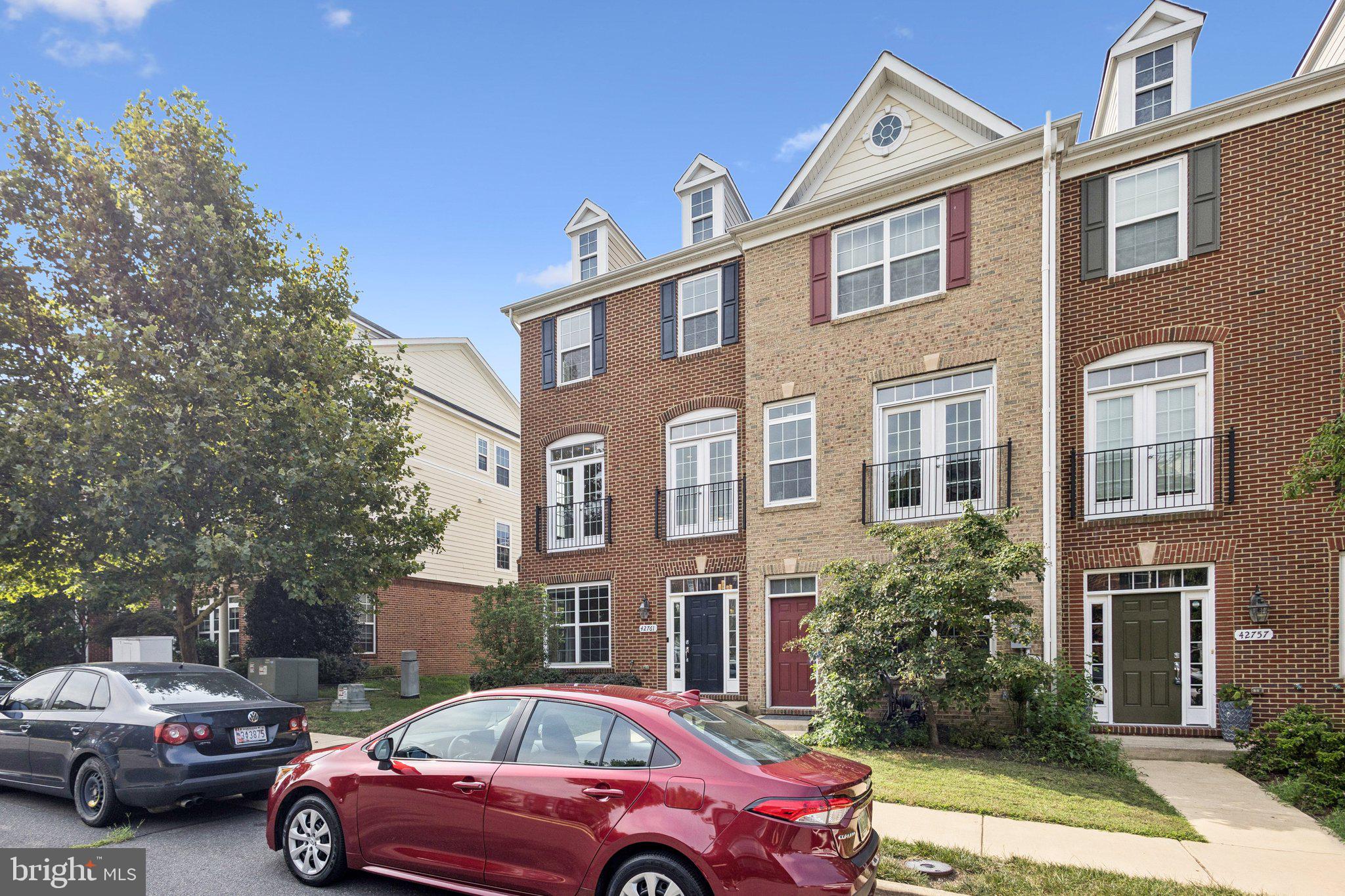 42761 Hay Road Ashburn, VA 20147 - Photo 24 of 46 a front view of a building with trees