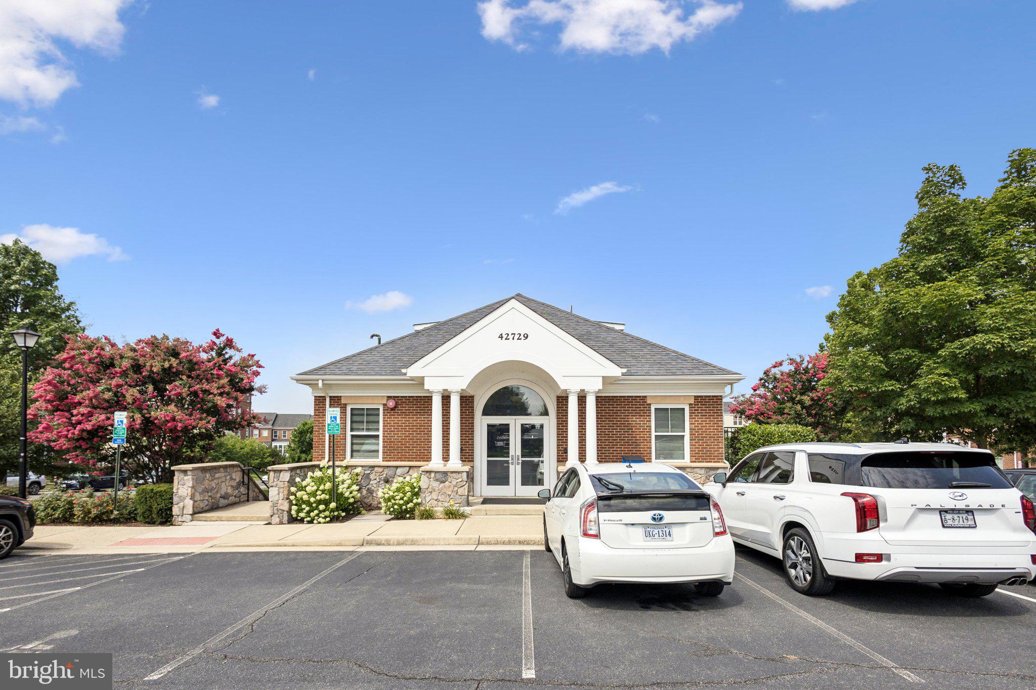 42761 Hay Road Ashburn, VA 20147 - Photo 25 of 46 a view of a car parked in front of a house