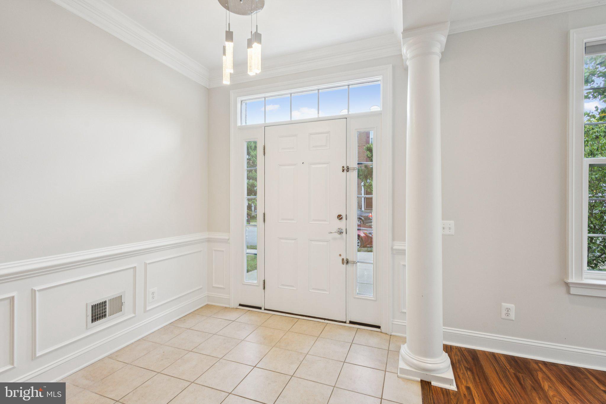 42761 Hay Road Ashburn, VA 20147 - Photo 3 of 46 a view of an empty room with window and chandelier fan