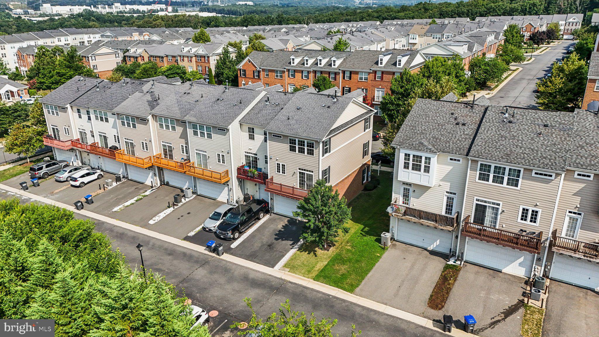 42761 Hay Road Ashburn, VA 20147 - Photo 35 of 46 an aerial view of multiple houses with a lake