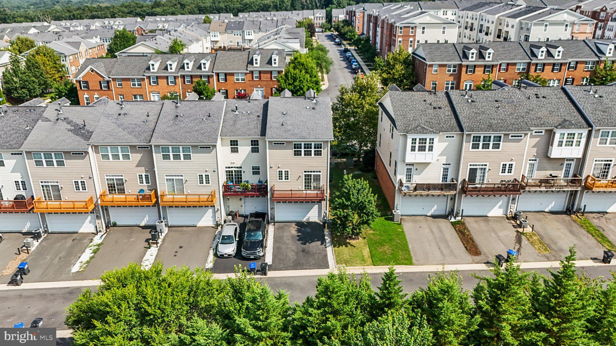42761 Hay Road Ashburn, VA 20147 - Photo 36 of 46 an aerial view of a house with a yard table and chairs