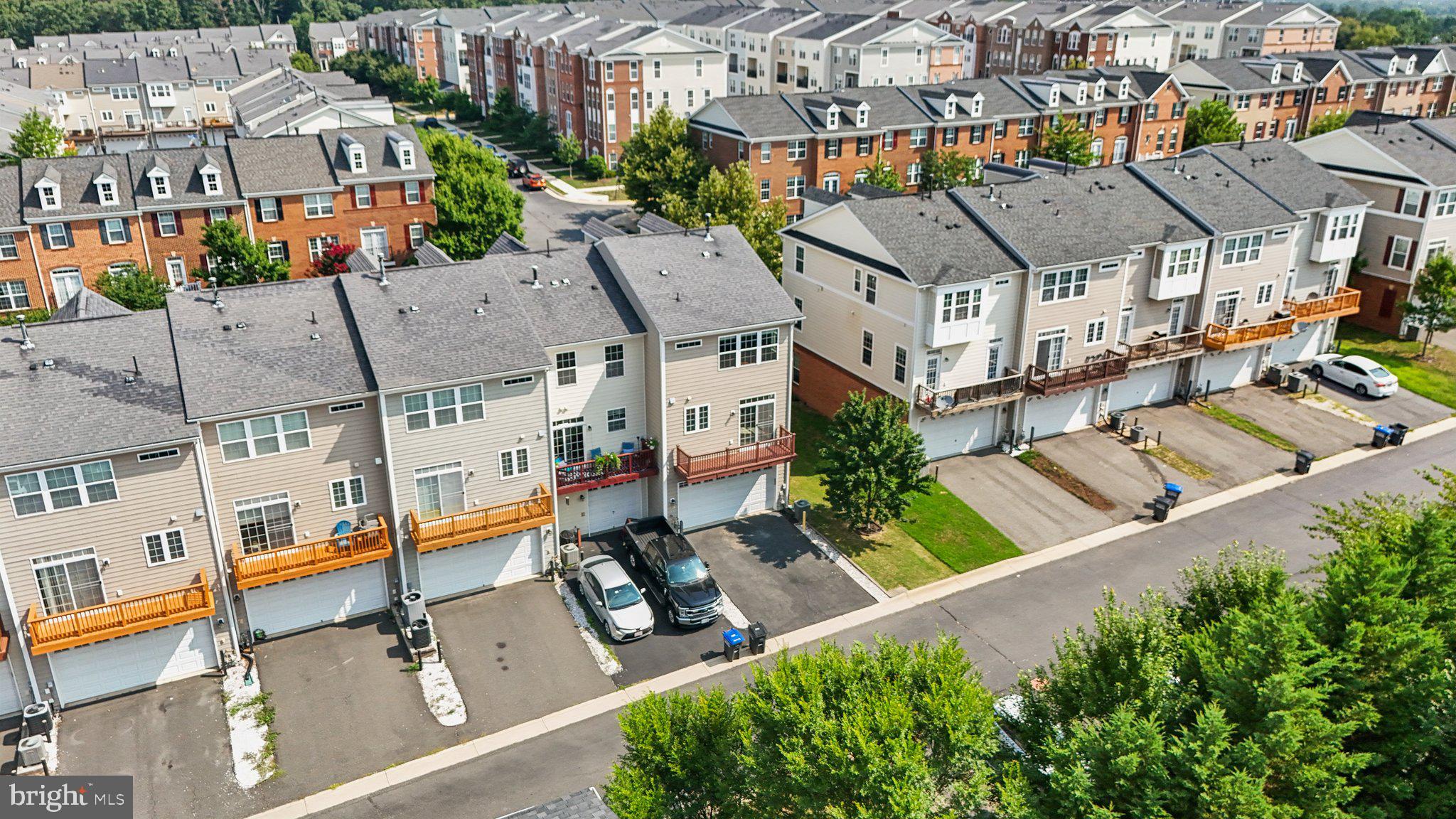 42761 Hay Road Ashburn, VA 20147 - Photo 37 of 46 an aerial view of multiple houses with a yard