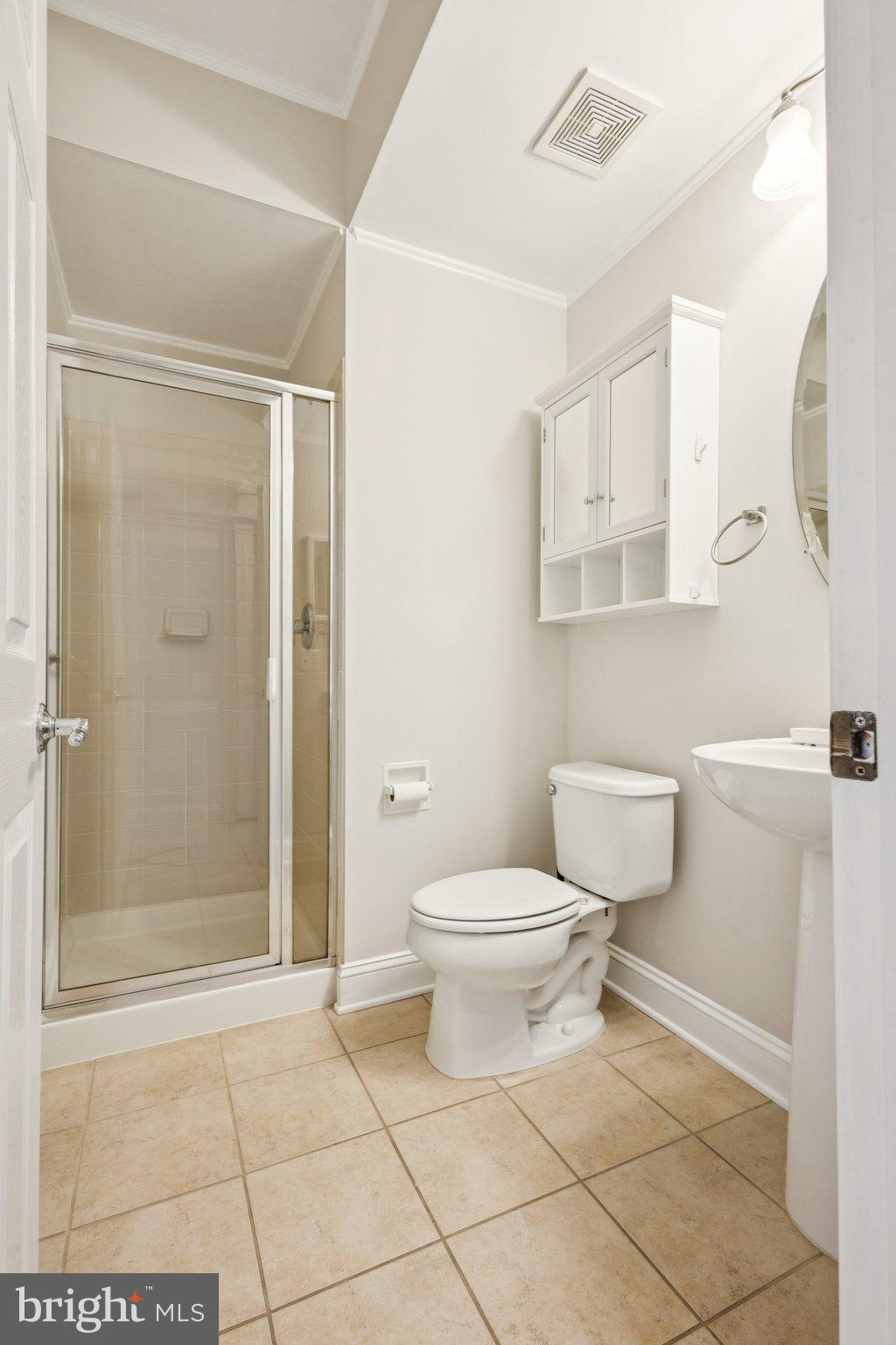 42761 Hay Road Ashburn, VA 20147 - Photo 5 of 46 a bathroom with a toilet a sink and shower