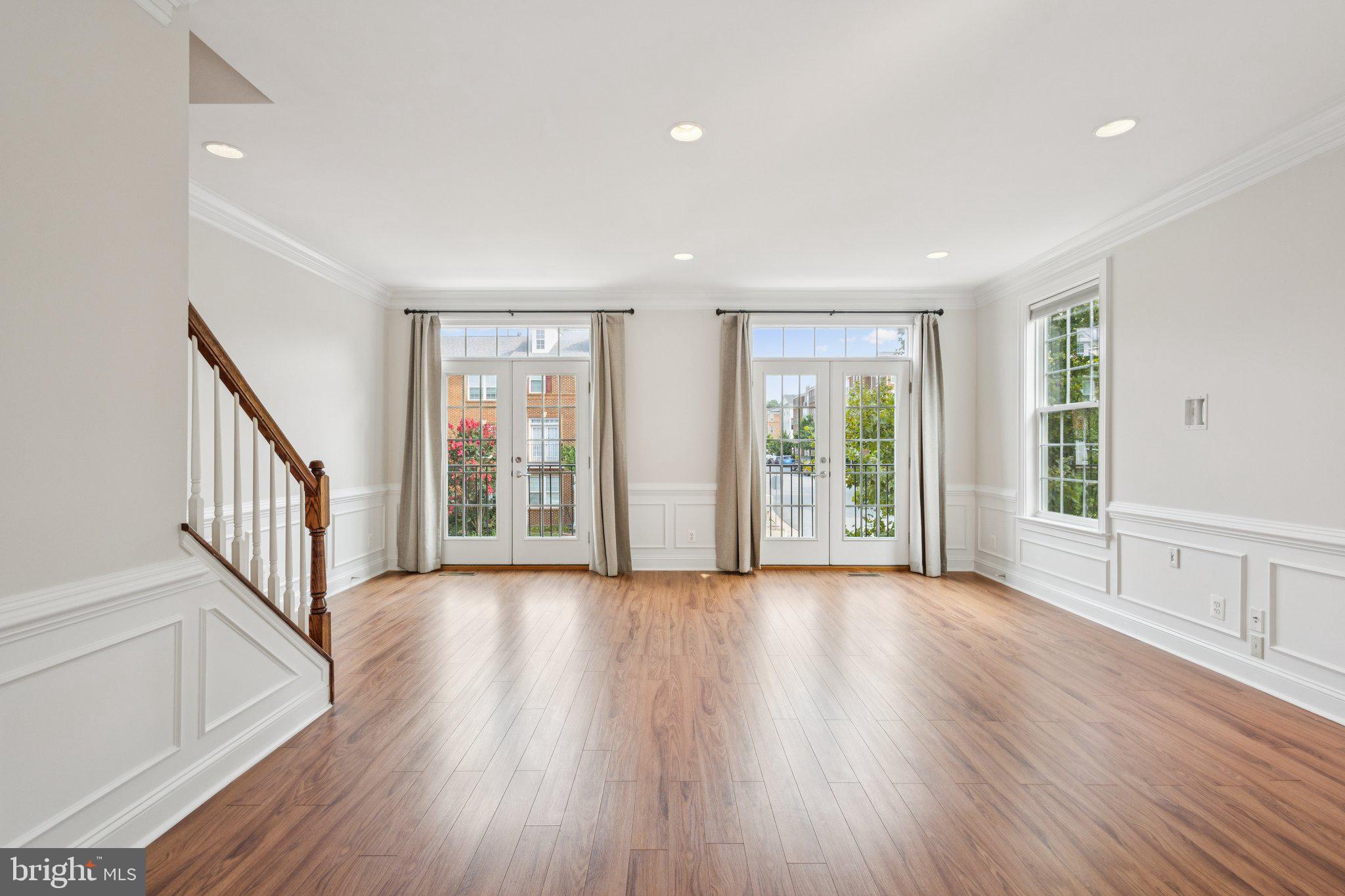 42761 Hay Road Ashburn, VA 20147 - Photo 6 of 46 an empty room with wooden floor and windows