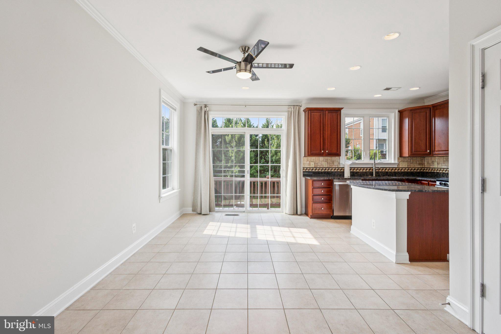 42761 Hay Road Ashburn, VA 20147 - Photo 10 of 46 a view of an empty room with a kitchen