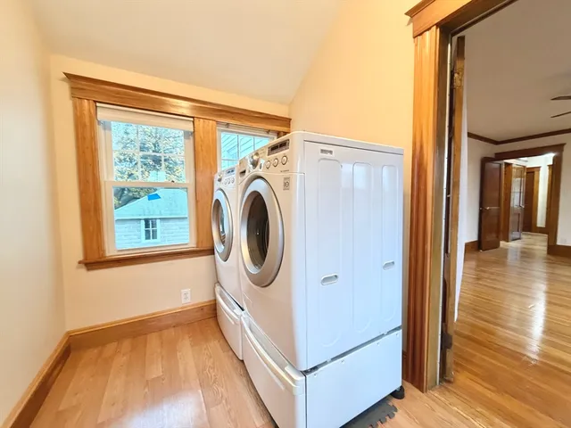 a view of a hallway with washer and dryer