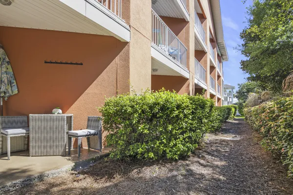 a view of a patio with table and chairs