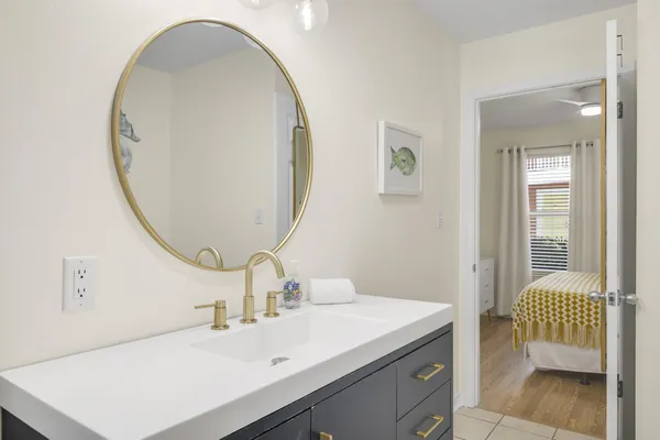 a bathroom with a sink and a mirror