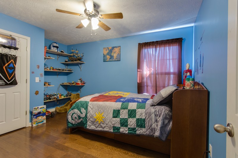 894 Mt Vernon Road Bethpage, TN 37022 - Photo 27 of 34 a bedroom with bed and wooden floor