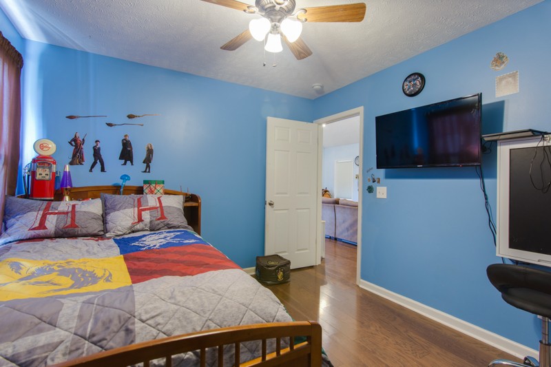 894 Mt Vernon Road Bethpage, TN 37022 - Photo 28 of 34 a bedroom with a bed and a flat screen tv