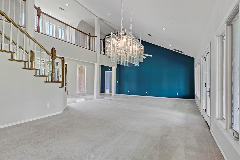 4905 Trails End Road Paris, TX 75462 - Photo 15 of 33 wooden floor in an empty room with a chandelier fan