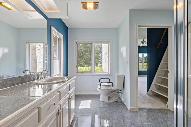 a spacious bathroom with a bathtub a sink a mirror and a shower