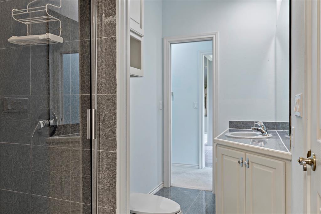 4905 Trails End Road Paris, TX 75462 - Photo 19 of 33 a bathroom with a sink toilet and shower
