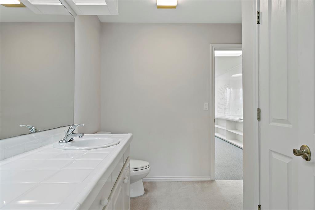 4905 Trails End Road Paris, TX 75462 - Photo 26 of 33 a bathroom with a sink a toilet and shower