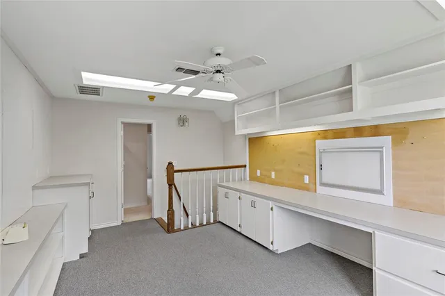 a spacious bathroom with a double vanity sink and a mirror