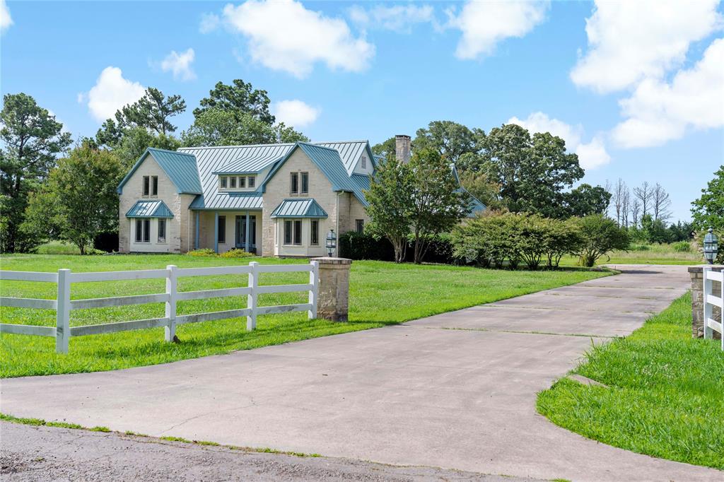 4905 Trails End Road Paris, TX 75462 - Photo 31 of 33 a front view of a house with a yard and potted plants