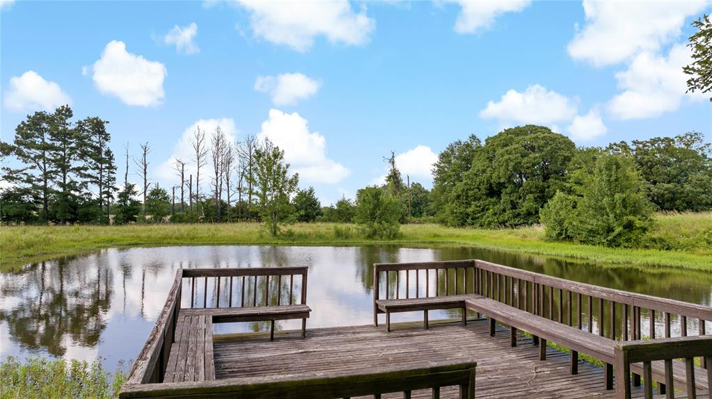 4905 Trails End Road Paris, TX 75462 - Photo 5 of 33 a view of a deck with hardwood floor and lake view