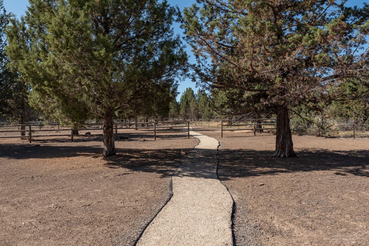 18285 Pinehurst Road Bend, OR 97703 - Photo 25 of 25 a view of a yard with large trees
