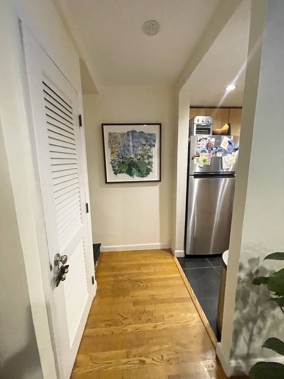9 Primus Avenue, Unit 1 Boston, MA 02114 - Photo 9 of 19 a view of a hallway view with staircase and a bathroom